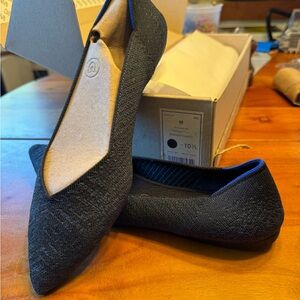 Rothy's Elegant Black Flats with Vibrant Blue Trim
